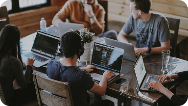 People collaborating on laptops